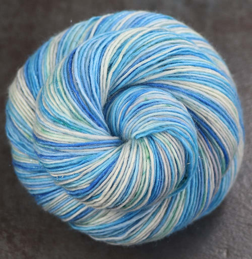 ABOVE THE EDGE: SW Merino / Stellina Sparkle - Hand dyed variegated fingering yarn